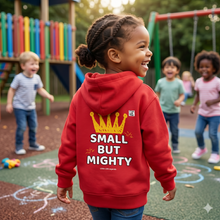 Load image into Gallery viewer, Child wearing a red hoodie with 'Small But Mighty' text on a playground
